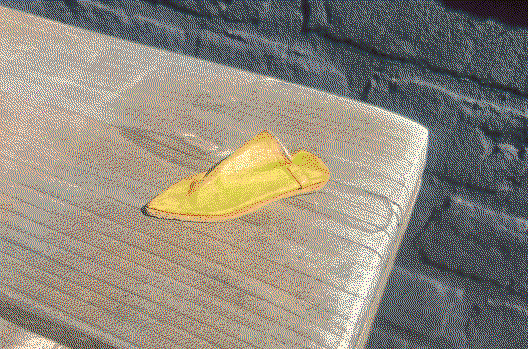 small yellow leather slipper